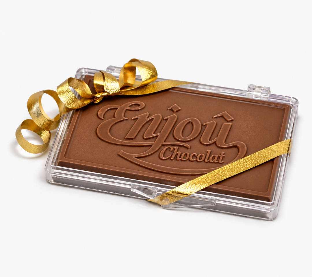 Milk chocolate business card with the Enjou logo in a clear case with gold ribbon