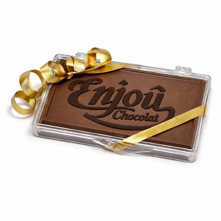 Milk chocolate business card with a dark chocolate Enjou Chocolat logo, in a clear case with gold ribbon