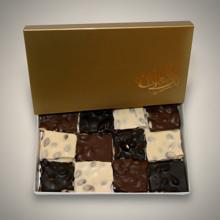 Enjou Chocolat one pound box of assorted almond bark squares in milk, dark, and white chocolate.