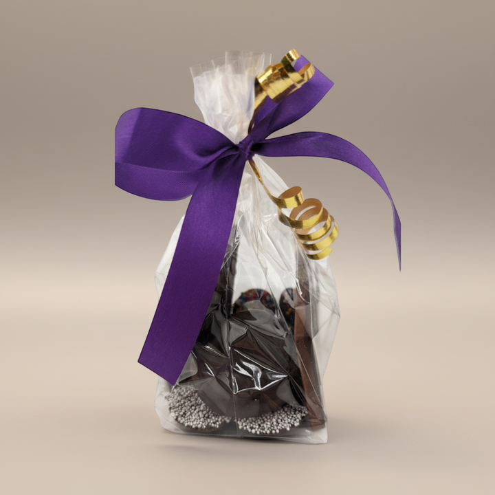 Enjou Chocolat Anniversary Package: chocolate-covered graham cracker, Oreos, nonpareils, and chocolate bar, tied with a purple ribbon.