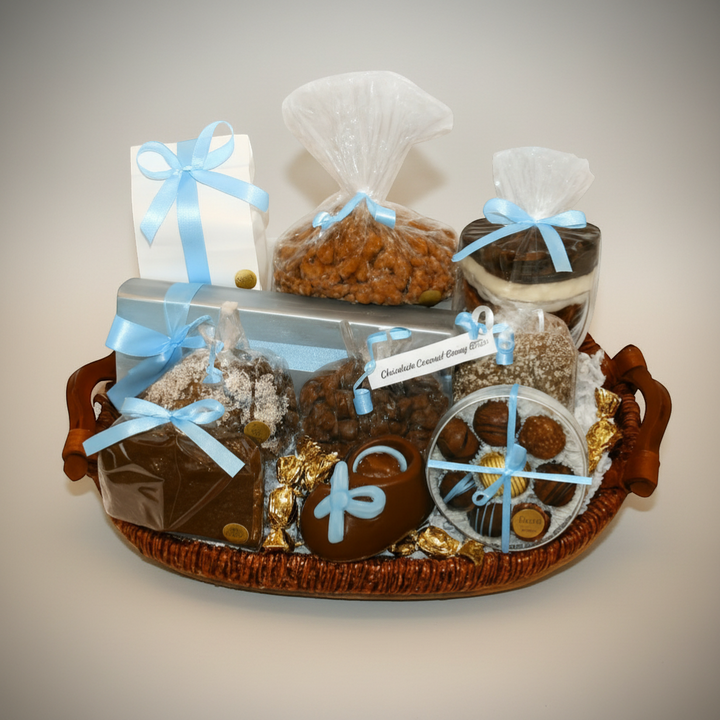 Enjou Chocolat baby gift basket with assorted chocolates, chocolate-covered Oreos, pretzels, biscotti, and a chocolate baby shoe.