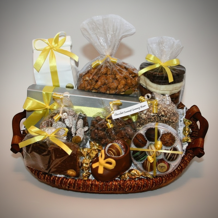 Enjou Chocolat baby gift basket with assorted chocolates, chocolate-covered Oreos, pretzels, biscotti, and a chocolate baby shoe.
