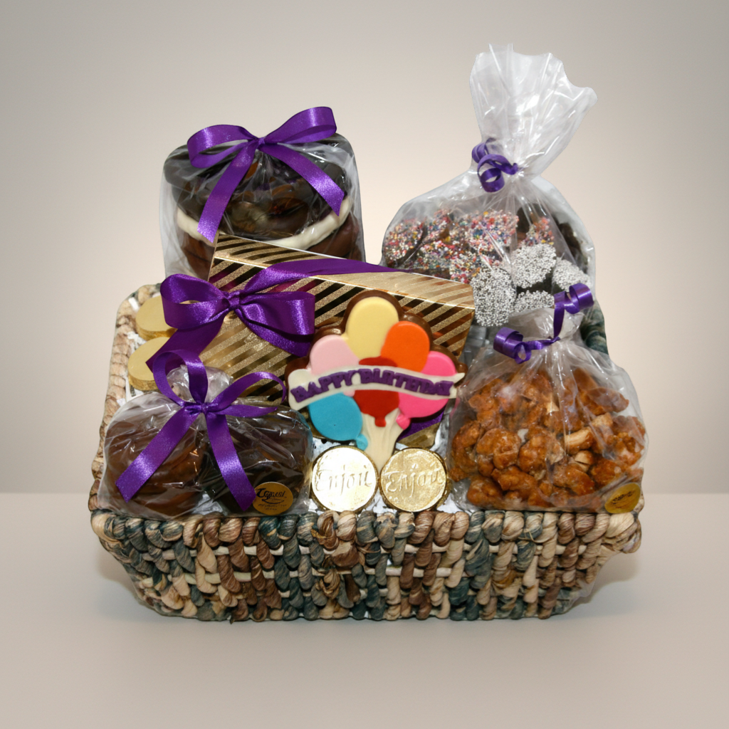 Enjou Chocolat birthday gift basket with gourmet chocolates, chocolate covered Oreos, pretzels, nuts, and a Happy Birthday balloon cookie.