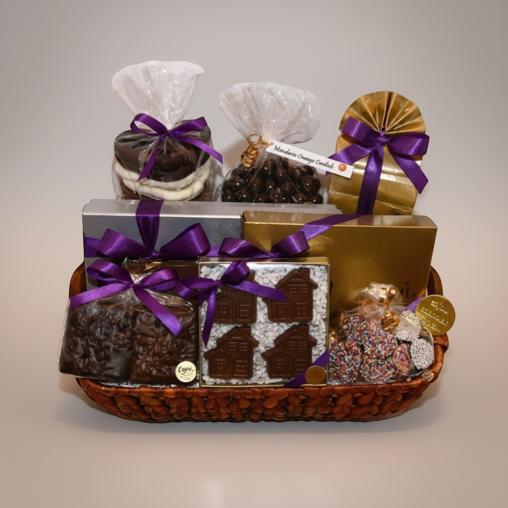 Enjou Chocolat New Home Basket with assorted chocolates, chocolate covered grahams, pretzels, Oreos, cordials, and chocolate houses.
