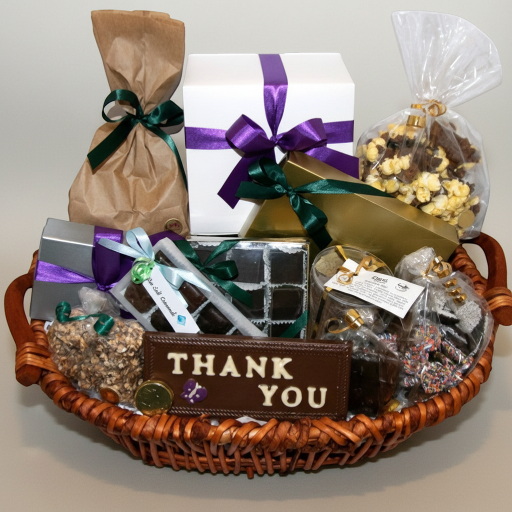 Enjou Chocolat Thank You basket filled with assorted chocolates, chocolate-covered pretzels, Oreos, graham crackers, popcorn, and biscotti.