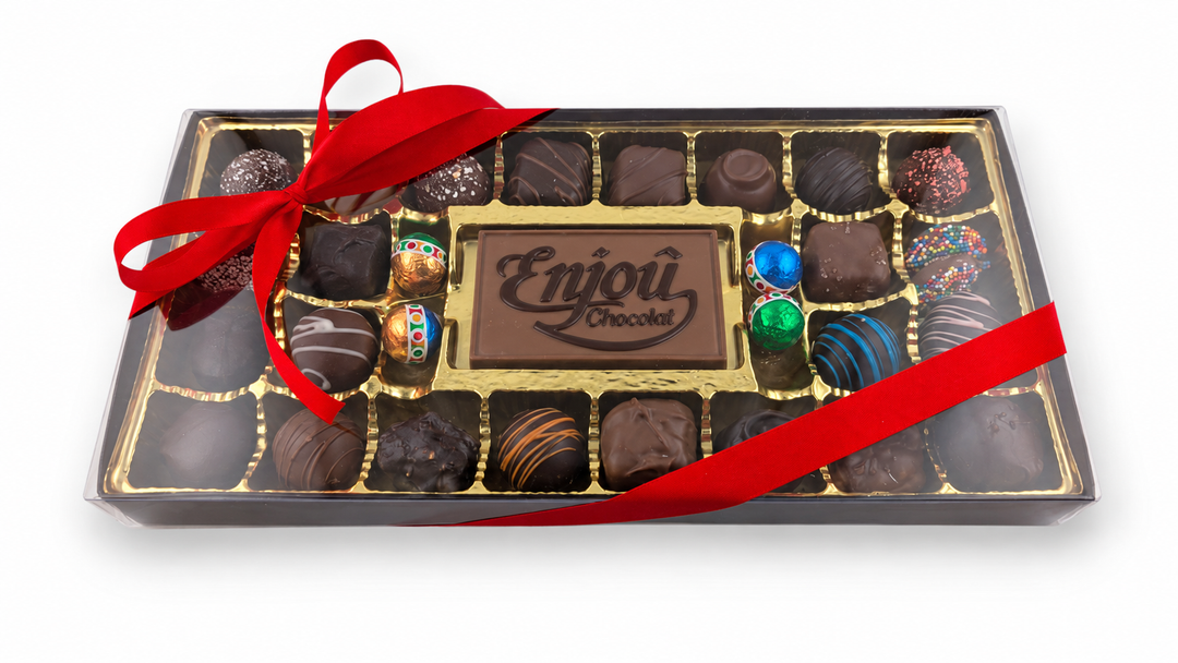 Large Corporate Card Collection at an angle under a clear lid, with an Enjou Chocolat logo card and assorted chocolates